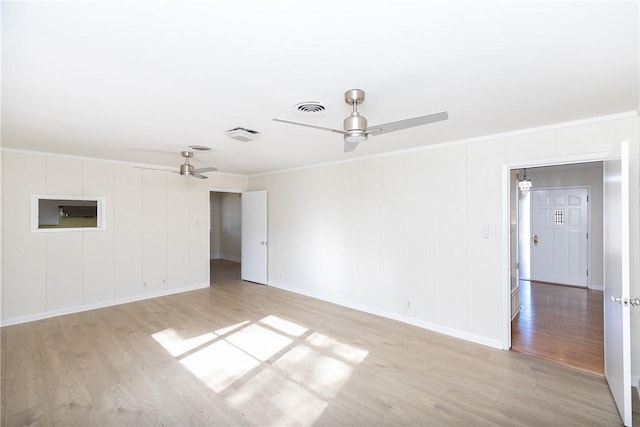 spare room featuring light hardwood / wood-style floors and ceiling fan