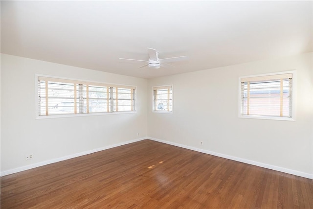 unfurnished room with ceiling fan and wood-type flooring