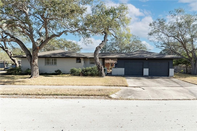 single story home featuring a garage