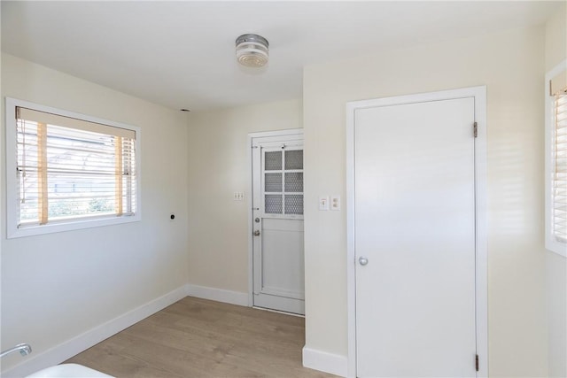 doorway to outside with light hardwood / wood-style floors