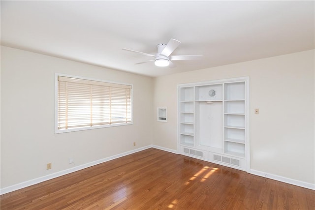 unfurnished room featuring ceiling fan and hardwood / wood-style floors