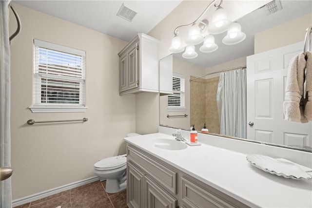 bathroom with tile patterned floors, vanity, a shower with shower curtain, and toilet