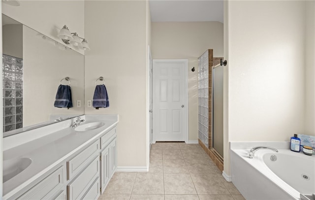 bathroom with vanity, tile patterned flooring, and plus walk in shower