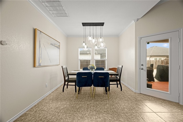 dining room featuring an inviting chandelier and crown molding