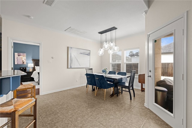 dining space with a notable chandelier and ornamental molding