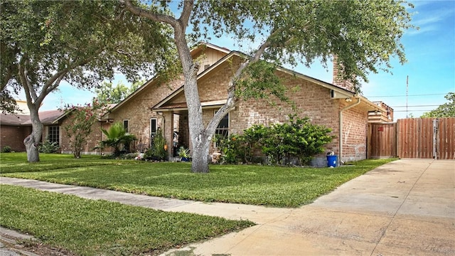 6813 Braesvalley Dr, Corpus Christi, TX 78413 - view of front of house with brick siding and a chimney