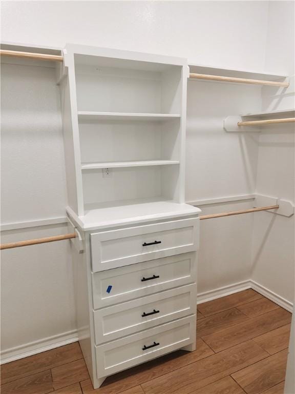 spacious closet featuring wood finished floors