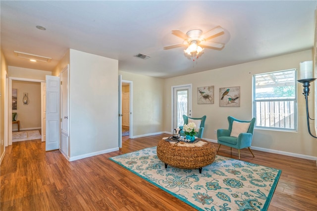 living area with hardwood / wood-style flooring, a healthy amount of sunlight, and ceiling fan