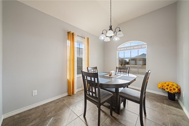 dining space with vaulted ceiling, tile patterned floors, and a chandelier