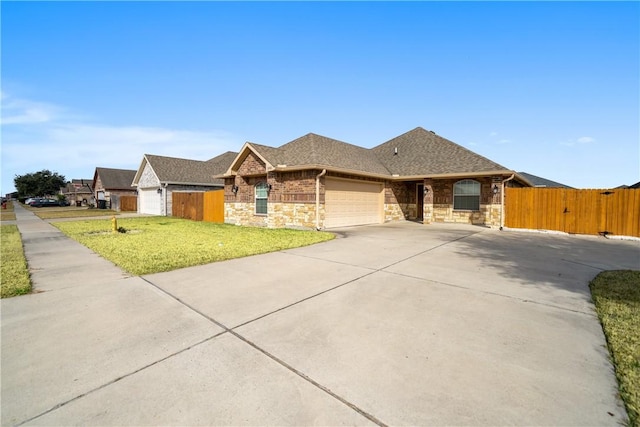 view of front of home featuring a garage and a front lawn