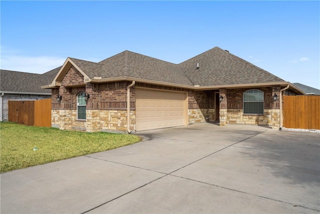 single story home featuring a garage and a front lawn