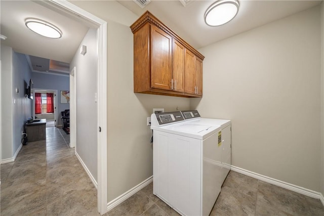 washroom with cabinets and independent washer and dryer