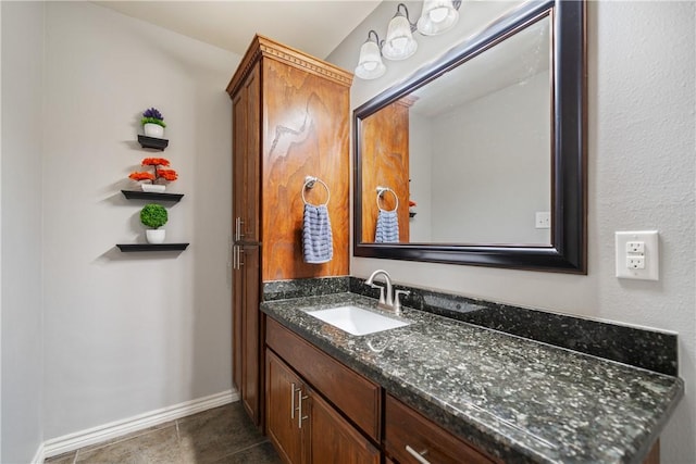 bathroom featuring tile patterned flooring and vanity