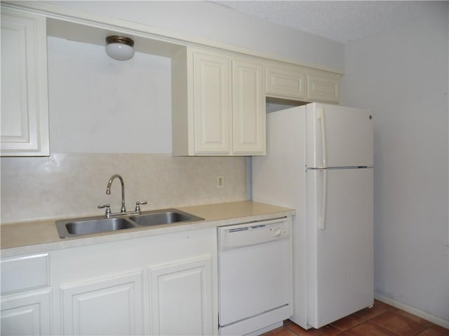 13656 Teague Ln Unit 33, Corpus Christi, TX 78410 - kitchen with white appliances, a sink, light countertops, backsplash, and dark tile patterned floors