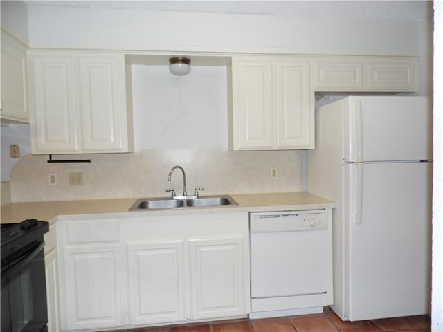 13656 Teague Ln Unit 33, Corpus Christi, TX 78410 - kitchen with white appliances, a sink, light countertops, and white cabinets