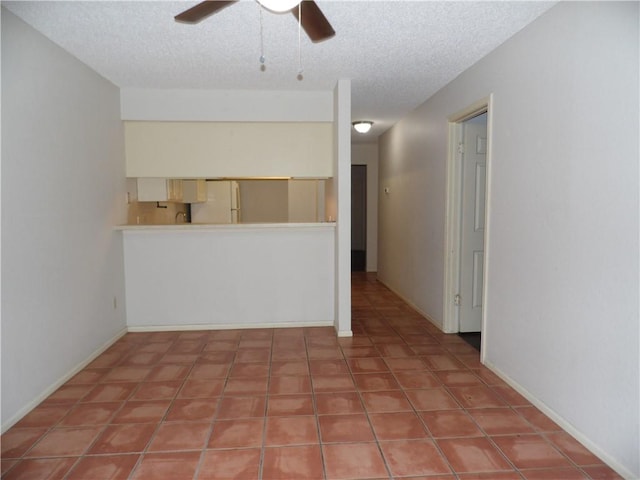 13656 Teague Ln Unit 33, Corpus Christi, TX 78410 - spare room with a ceiling fan, a textured ceiling, and tile patterned floors