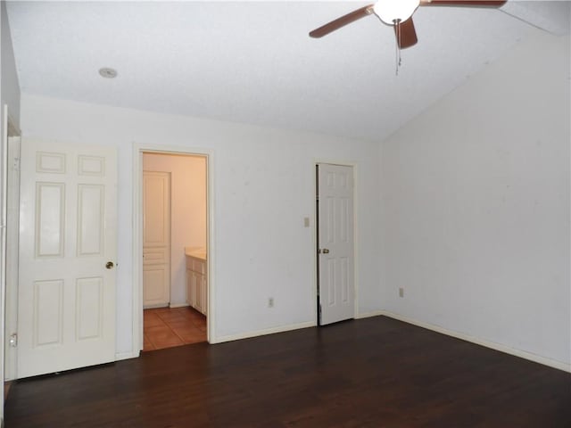 13656 Teague Ln Unit 33, Corpus Christi, TX 78410 - unfurnished bedroom featuring wood finished floors, baseboards, ensuite bath, and ceiling fan