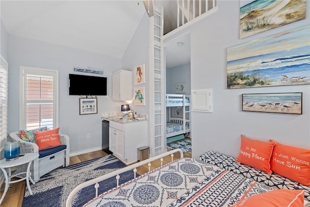 16025 Cuttysark St, Corpus Christi, TX 78418 - bedroom featuring baseboards, a sink, wood finished floors, and high vaulted ceiling