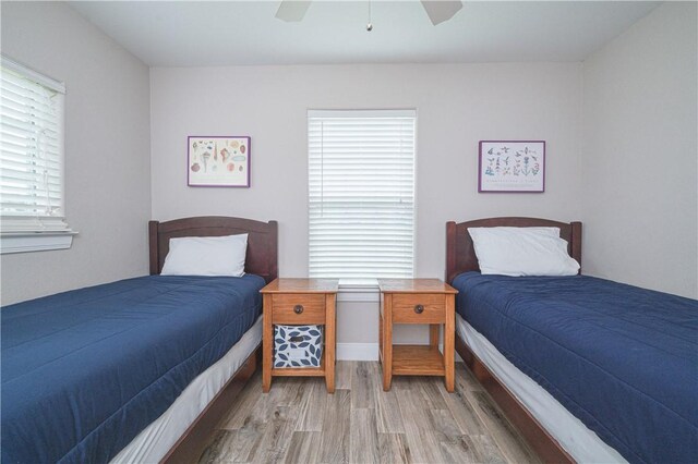 bedroom featuring ceiling fan and light hardwood / wood-style flooring