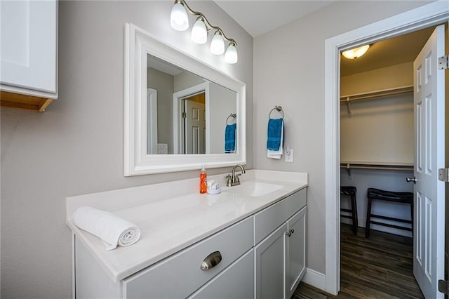 bathroom with vanity and wood-type flooring