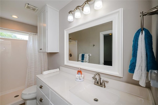 bathroom with vanity, toilet, and a shower with shower curtain