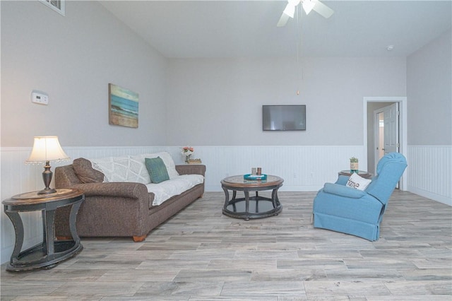 living room featuring ceiling fan and light wood-type flooring