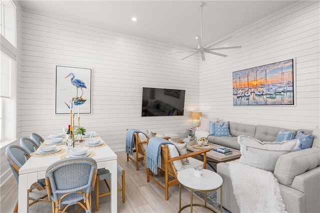 living area with light wood-style floors, ceiling fan, and recessed lighting