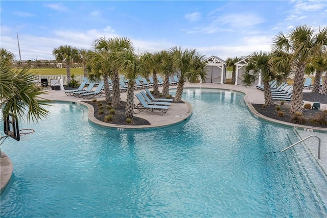 pool featuring a patio and fence