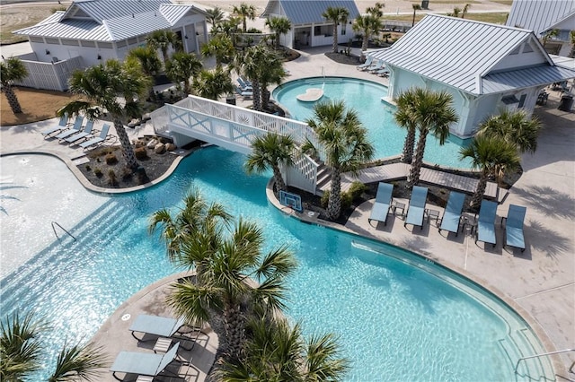 community pool with a lanai and a patio