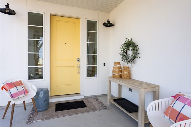 view of exterior entry with stucco siding