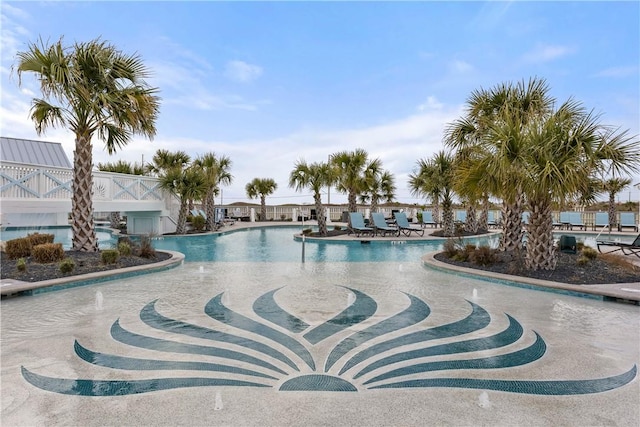 community pool with a patio area