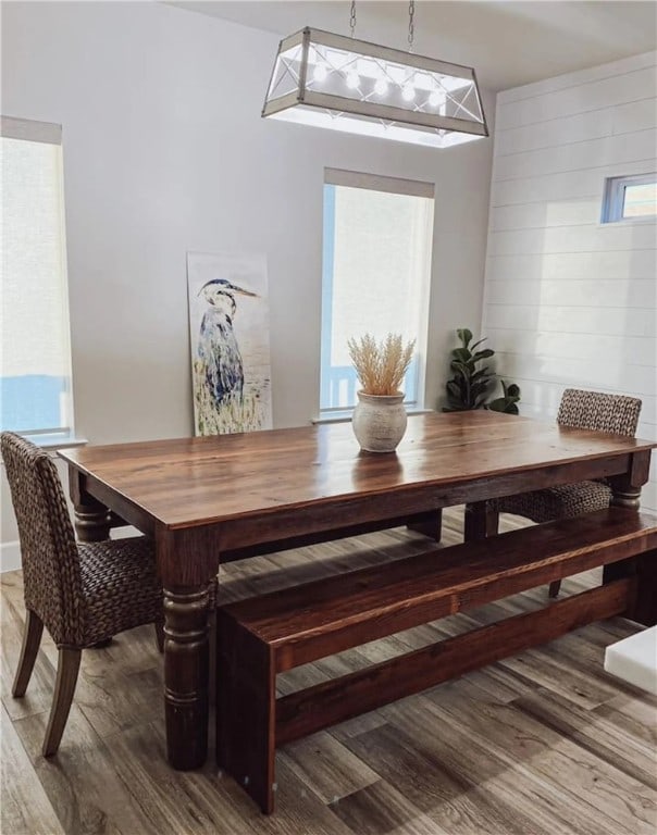  - dining space featuring wood finished floors