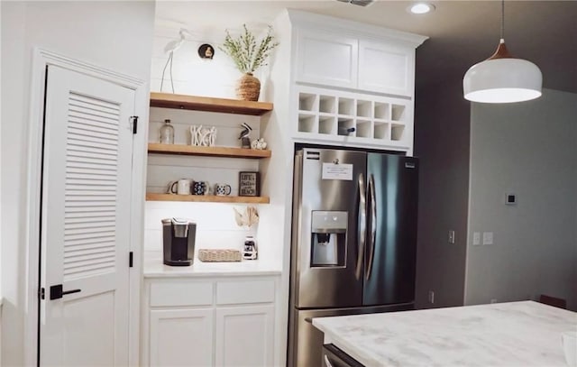  - kitchen featuring stainless steel fridge with ice dispenser, white cabinetry, open shelves, and recessed lighting