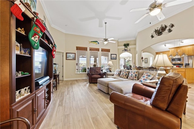13805 Hawksnest Bay Dr, Corpus Christi, TX 78418 - living room featuring a ceiling fan, arched walkways, light wood-type flooring, and crown molding