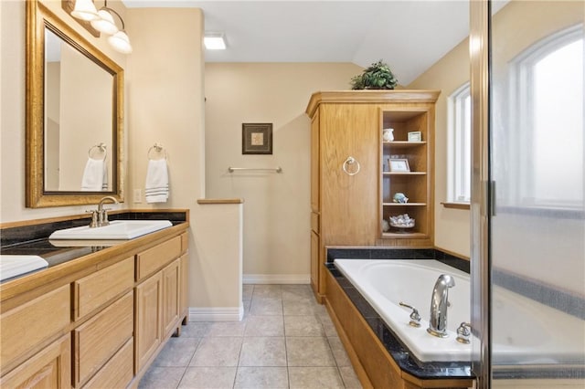 13805 Hawksnest Bay Dr, Corpus Christi, TX 78418 - full bath with lofted ceiling, vanity, healthy amount of natural light, a bath, and tile patterned floors