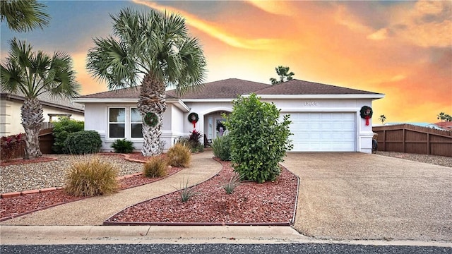 ranch-style home with a garage