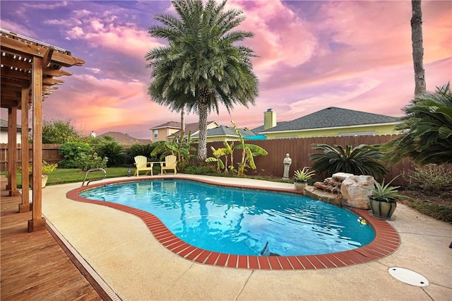13805 Hawksnest Bay Dr, Corpus Christi, TX 78418 - pool at dusk featuring a fenced backyard