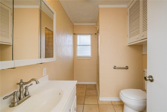 bathroom with crown molding, vanity, toilet, and tile patterned flooring