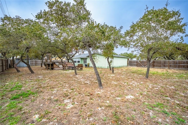 view of yard featuring a wooden deck