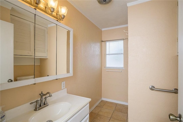 bathroom featuring ornamental molding, tile patterned floors, toilet, and vanity