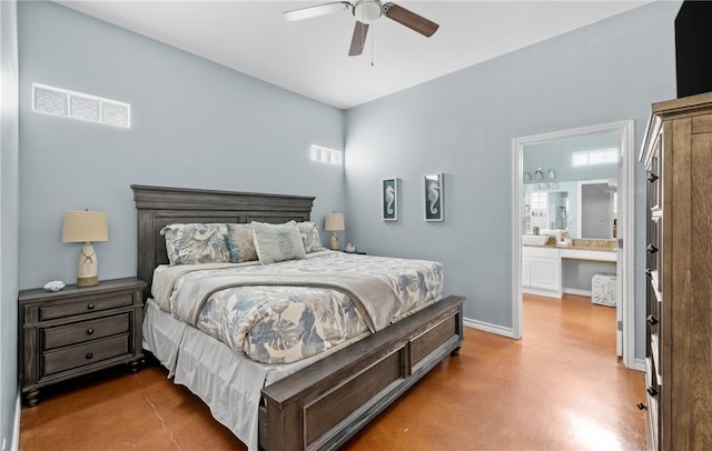 2212 State Highway 361, Port Aransas, TX 78373 - bedroom with concrete flooring, multiple windows, connected bathroom, and a ceiling fan