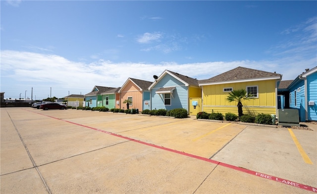 2212 State Highway 361, Port Aransas, TX 78373 - view of front of house featuring board and batten siding, uncovered parking, and a residential view