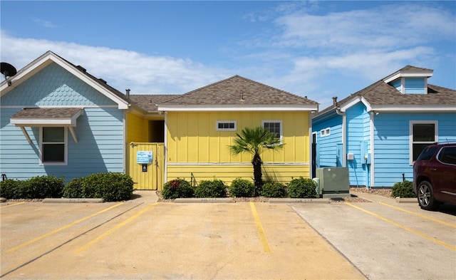 2212 State Highway 361, Port Aransas, TX 78373 - view of front of house featuring uncovered parking and roof with shingles