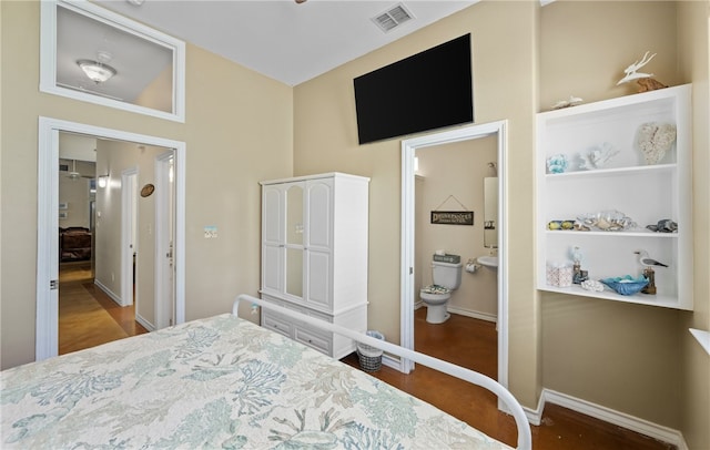 2212 State Highway 361, Port Aransas, TX 78373 - bedroom with baseboards and connected bathroom