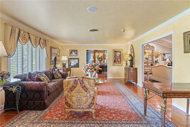 living area with crown molding, tile patterned floors, baseboards, and visible vents