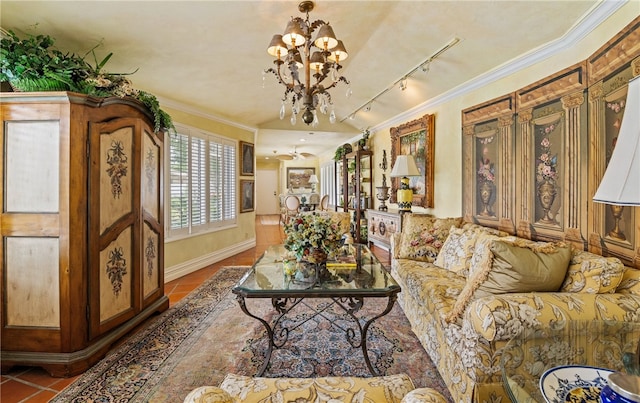 tiled living area with an inviting chandelier, track lighting, ornamental molding, and baseboards