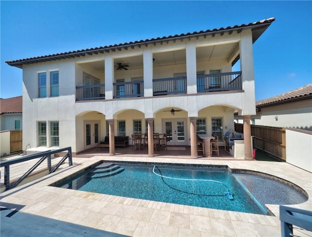 13834 Captains Row, Corpus Christi, TX 78418 - back of property featuring french doors, a balcony, ceiling fan, and a patio area