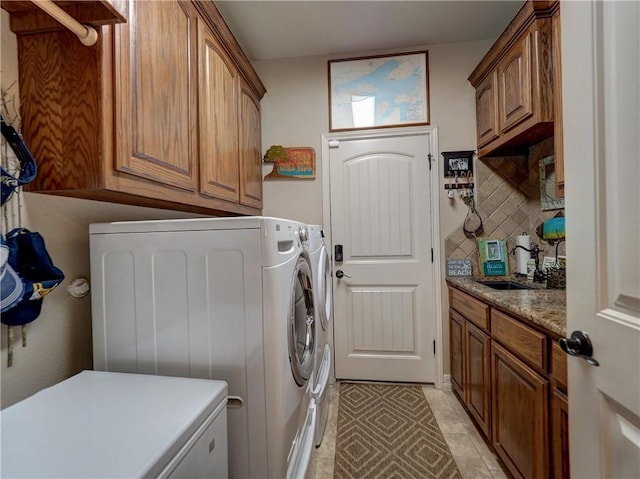 13834 Captains Row, Corpus Christi, TX 78418 - laundry area featuring washer and dryer and cabinet space