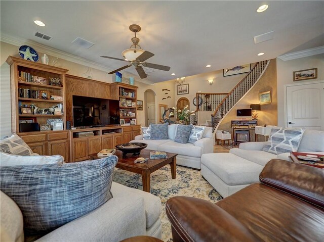 13834 Captains Row, Corpus Christi, TX 78418 - living room featuring stairway, crown molding, arched walkways, a ceiling fan, and recessed lighting