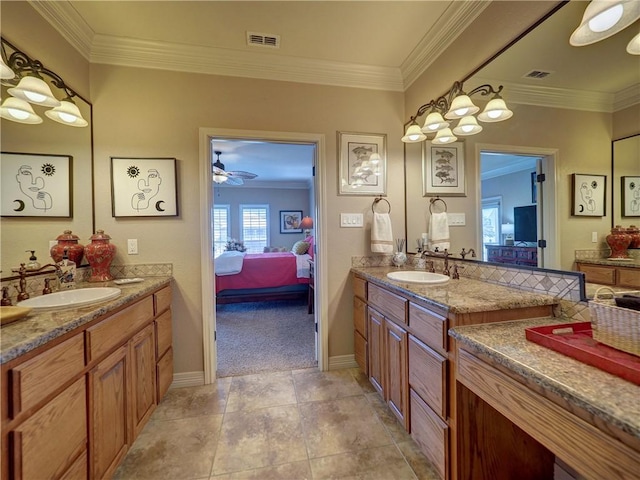 13834 Captains Row, Corpus Christi, TX 78418 - full bathroom with ensuite bath, two vanities, and crown molding